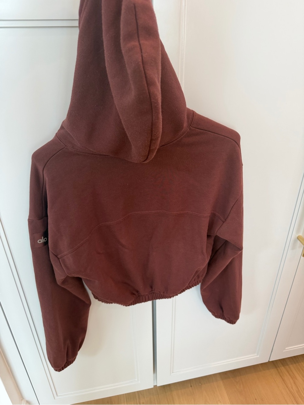 ALO Yoga Cropped Quarter-Zip Hoodie in Deep Brown - Picture 2 of 5
